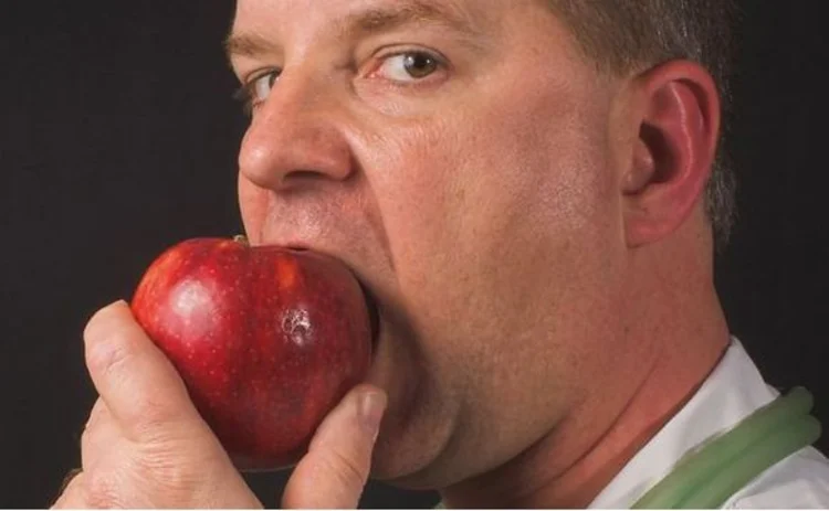 Doctor eating apple