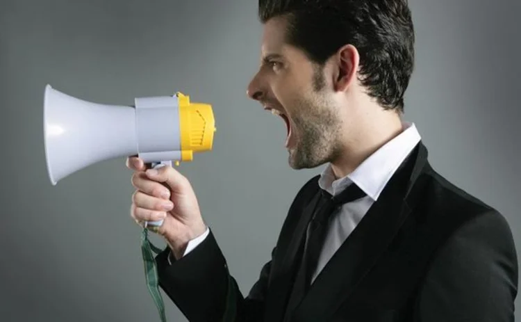 Man shouting into a megaphone