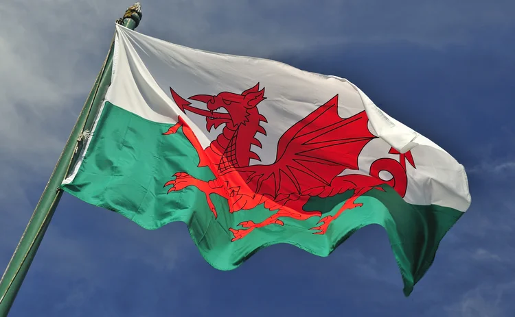 Welsh flag set against blue skies
