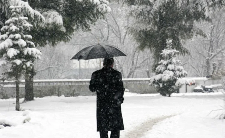 A man walking through snow