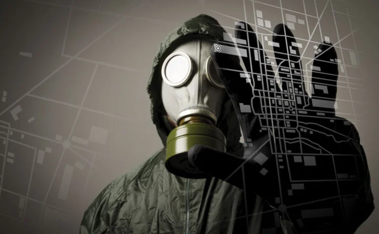 A terrorist in a gas mask holding his hand up to a digital image