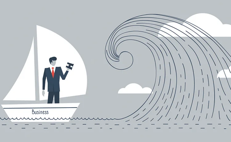 businessman-in-boat-facing-wave