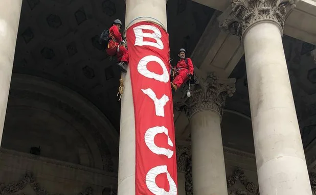  Activists scale Royal Exchange to launch “Boycott Bloody Insurance” Campaign