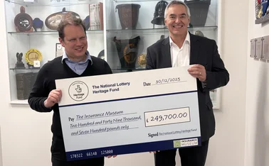Cheque being handed over to Insurance Museum from National Lottery