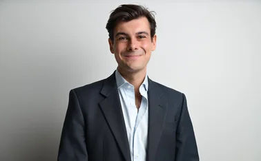 James Rendell CEO and founder of BirdEyeView stood against a white wall.