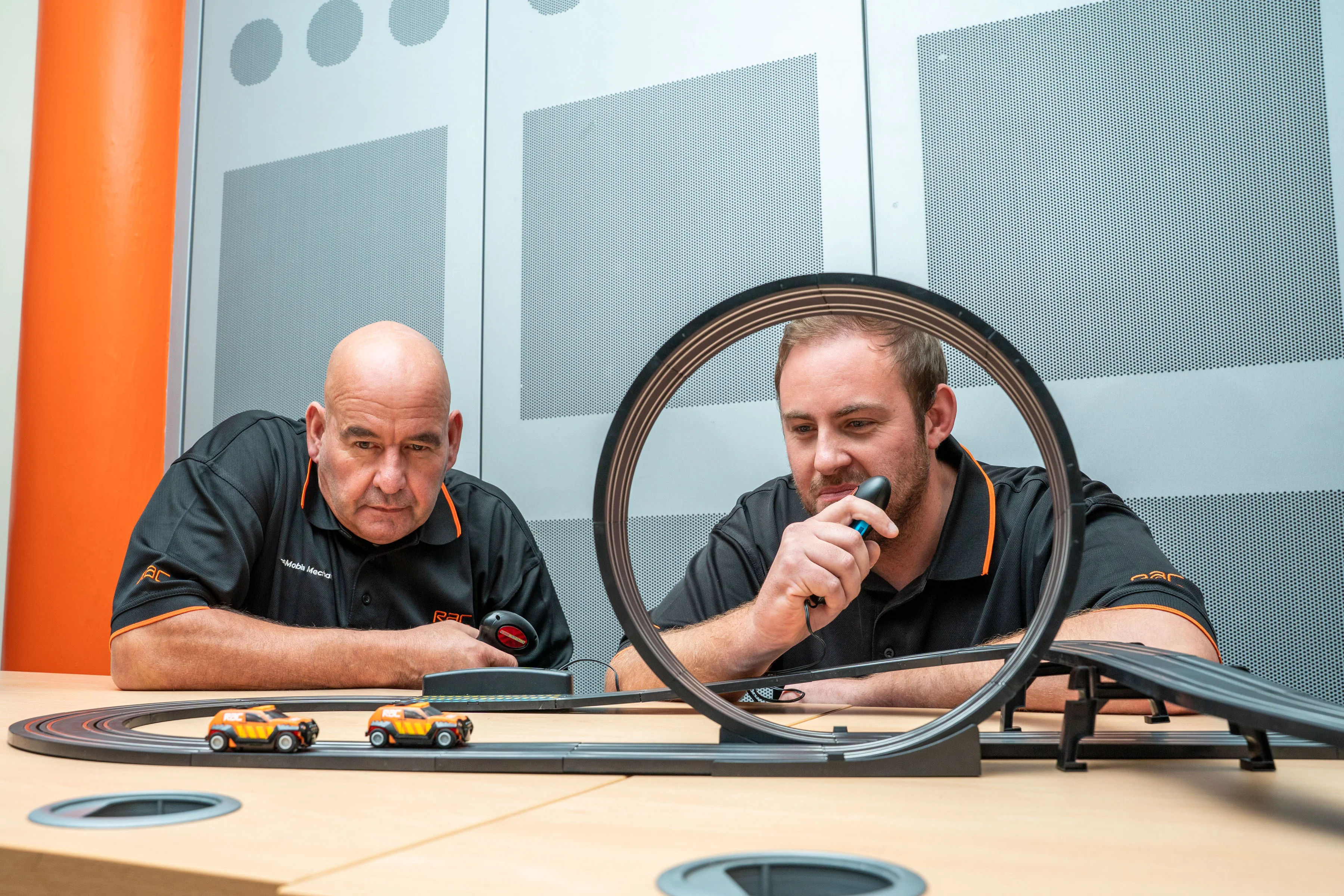 L - R: Sean Kimberlin, the RAC’s Mobile Mechanic of the Year and Chris Alexandrou, the RAC’s Patrol of the Year racing the cars.