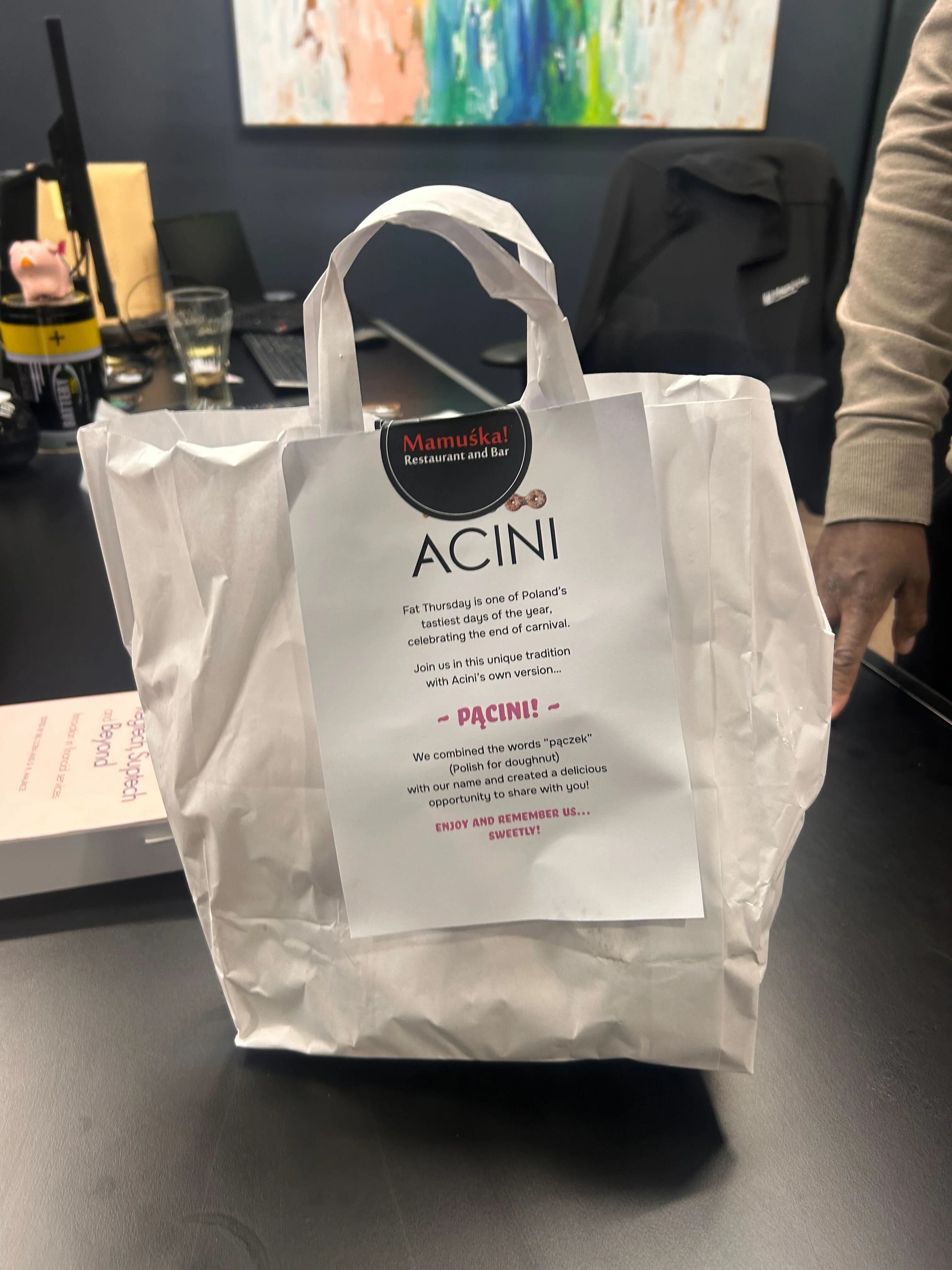 A white paper back on a desk.