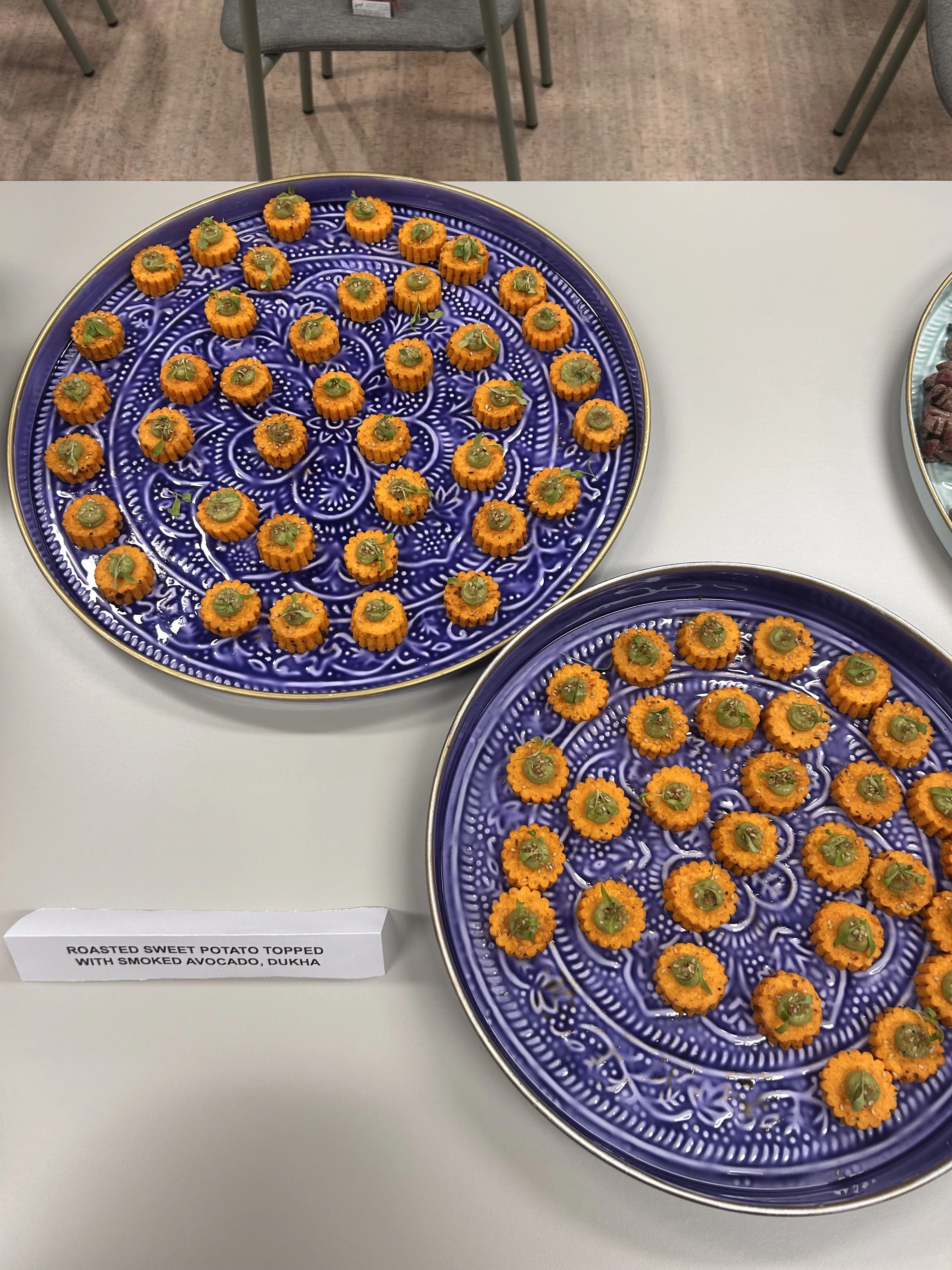 Two plates of roasted sweet potato.