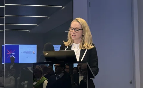 Lucy Rigby KC MP standing at a podium.