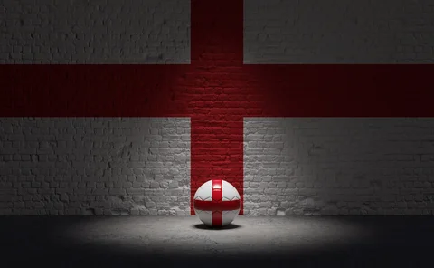A Brick Wall And A Ball With The Flag Of England