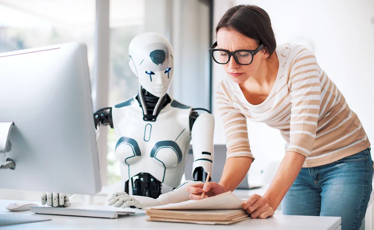 Robot and woman working together_paperwork and automation