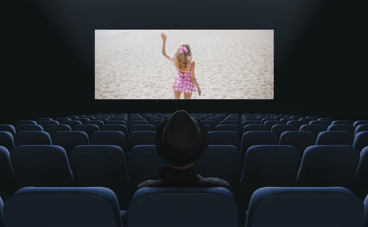 man watching woman on movie screen