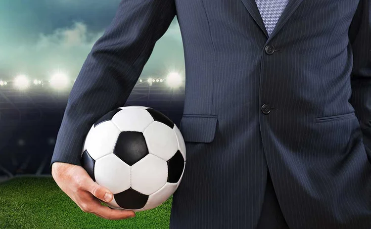 Businessman with football