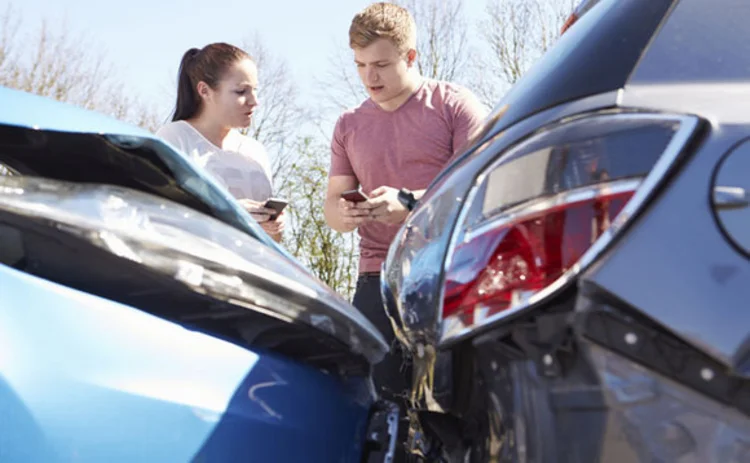 Drivers exchange details after a car crash