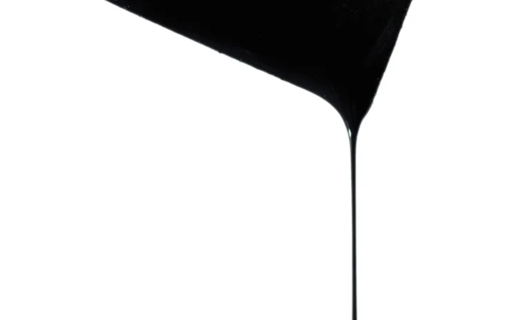 Oil dripping from a ten dollar bill