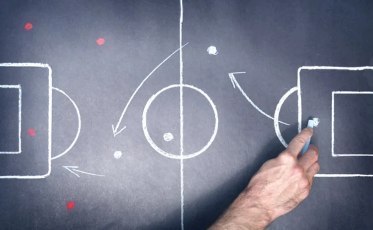 Football tactics drawn on a blackboard