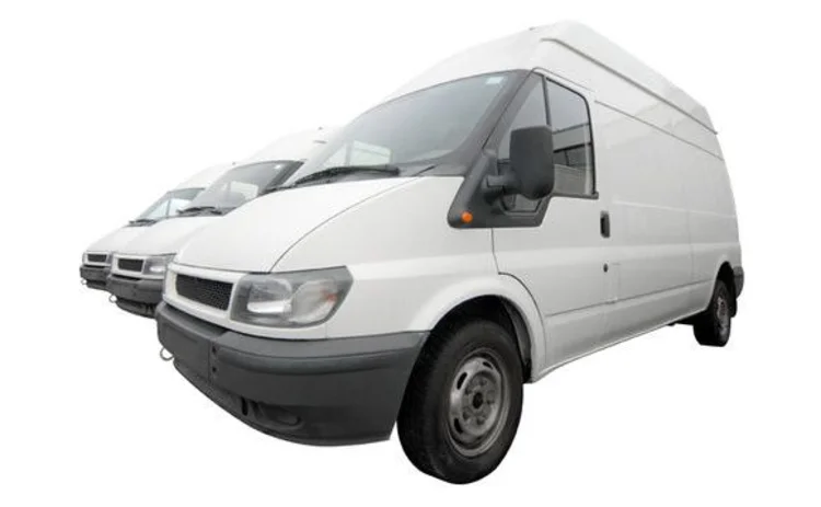 three-white-transit-vans