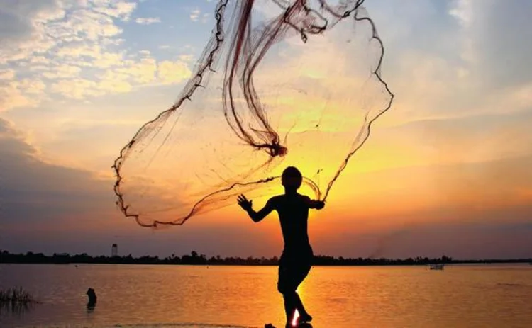 Fisherman casting a net