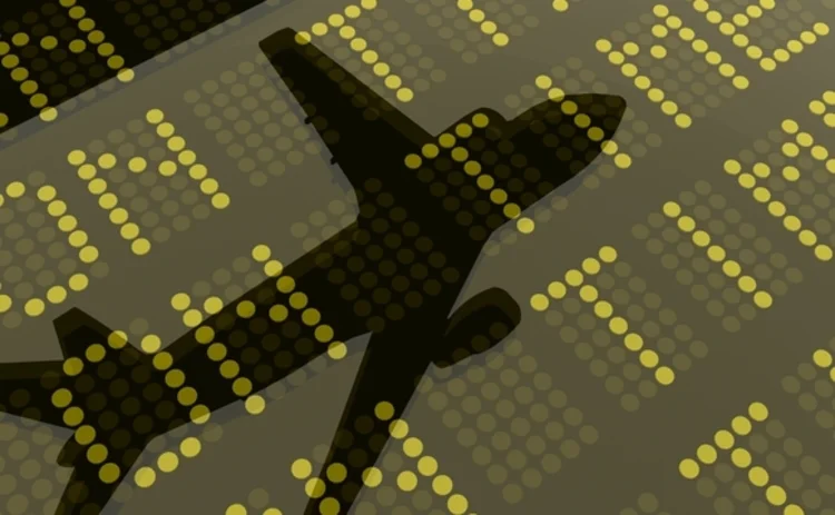 reflection-of-a-plane-on-a-departures-and-arrivals-5847536