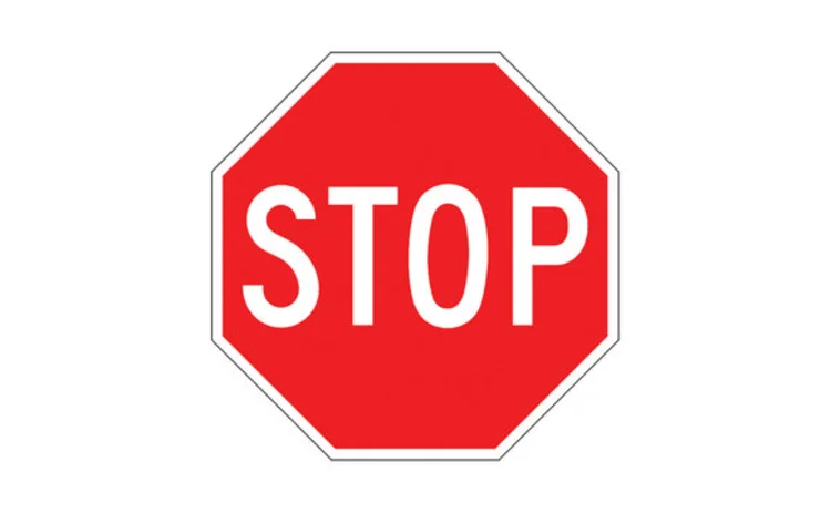 UK stop sign - the word STOP in white on a octagonal red background