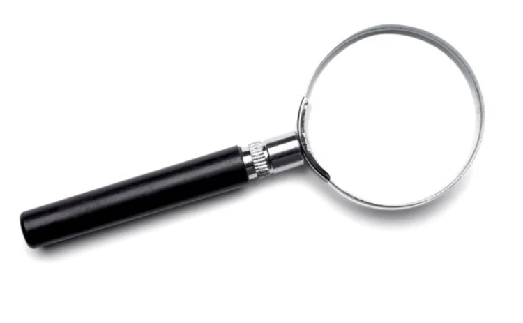 A magnifying glass with a black handle