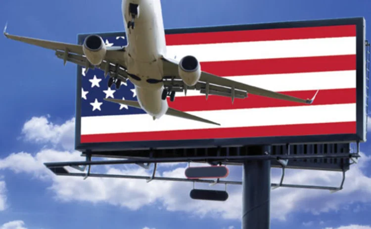 An aeroplane in front of an American flag