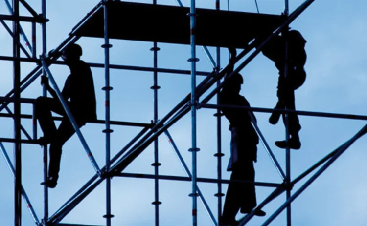 Builders on scaffolding