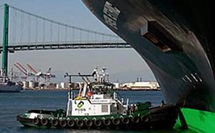 A hybrid tug boat in a harbour