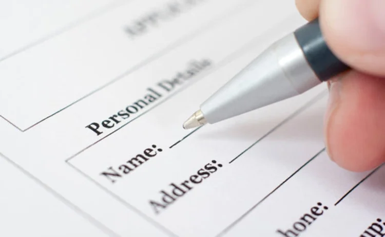 Someone filling out an application form