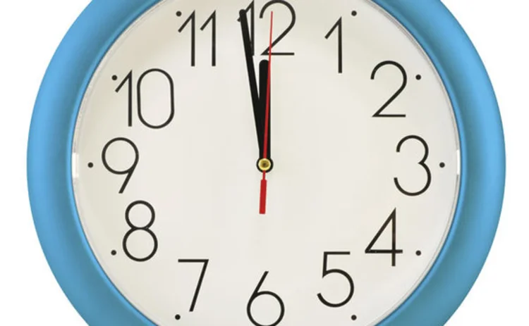 A clock showing the time as just before midnight