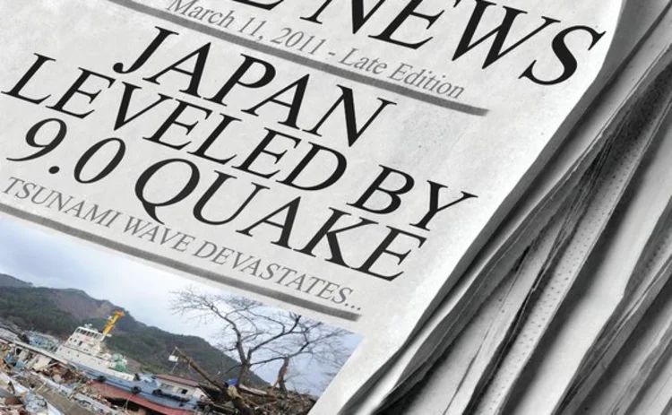 Japan earthquake headline in newspaper