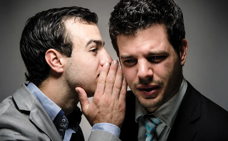 whispering-businessmen