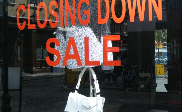 Recession slump closing down sign