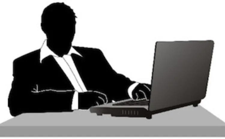 guy-in-suit-at-computer