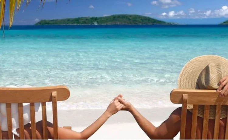 A male-female couple on an island beach holiday