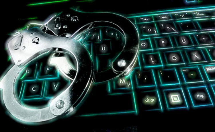 Handcuffs on a computer keyboard