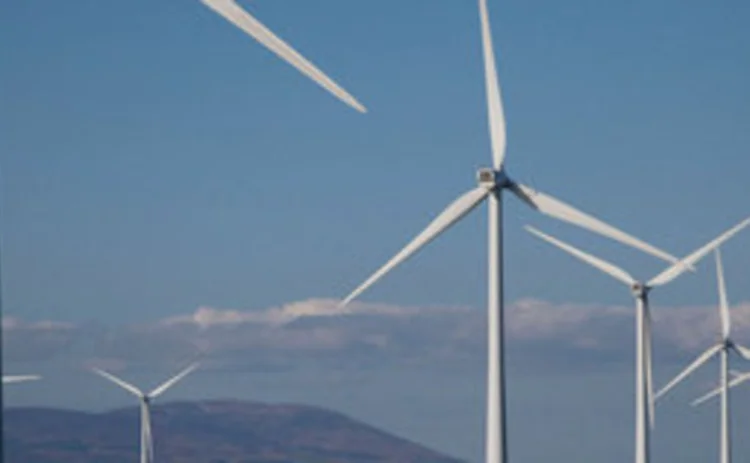 Offshore windfarm with land in the background