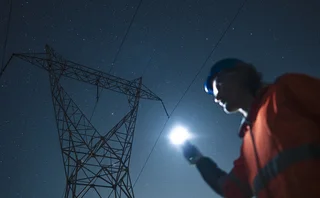 Renewable Energy & Electrical Smart Grid. Engineer Works Late At Night - stock photo