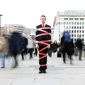 businessman in red tape