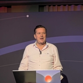 Dan Bishop, head of data at Hiscox UK, speaking at lectern