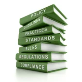 Regulations and compliance book stack - ESG concept