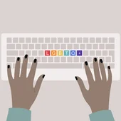 Hands typing on a keyboard, top view, rainbow buttons with an LGBTQ+ sign, queer community support